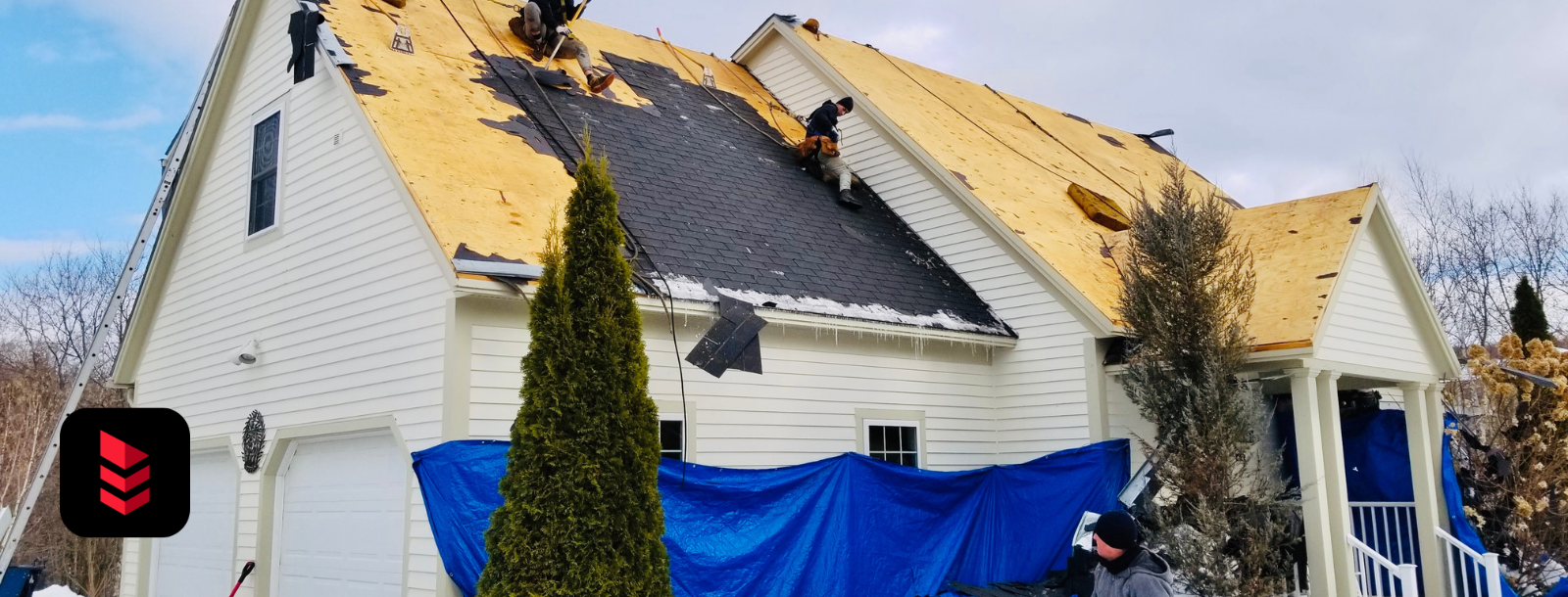 Winter residential roof replacement project in Vermont by RoofPros.Plus with snow on the ground